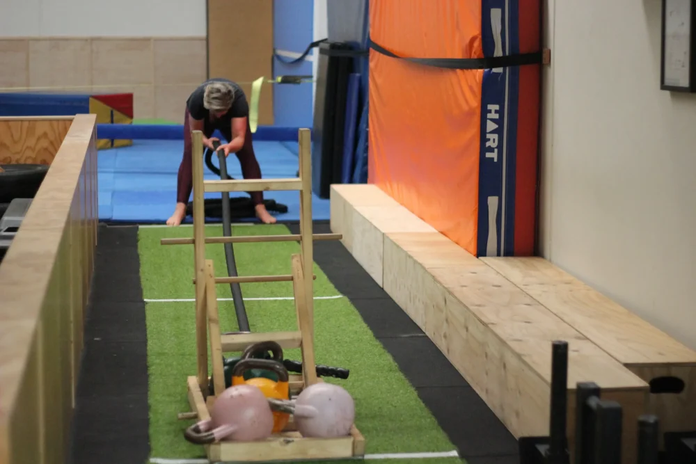 woman pulling a sled during a functional fitness class at functional fitness eltham australia